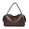 Bolsa de gimnasio negra para mujer al por mayor, bolsa de mano de gran capacidad, nuevo modelo 2026, estilo casual de alta gama con correa ancha