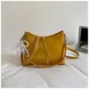 Bolsa lisa fresca e simples para mulheres 2026 novo estilo de outono inicial pequena quadrada casual minimalista para trabalho e dia a dia bolsa tiracolo de nicho