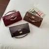 Bolso de mano transfronterizo 2026 nuevo modelo patrón de cocodrilo bolso Kelly, moderno y versátil, bolso cruzado cuadrado pequeño de alta calidad para mujer