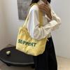 Bolsa de Lona 2026 Modelo Nuevo Gran Capacidad Bolso de Hombro para Mujer Bolso Tote Estilo Coreano Literario Versátil Casual Bolsa Perezosa Venta al por Mayor