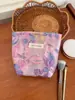Nueva Bolsa de Cosméticos Morada con Relieve de Flores de Gran Capacidad Transfronteriza Bolsa de Almacenamiento Portátil para Salir Bolso de Mano para Niña