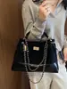 Bolso pequeño de cadena acolchado estilo Chanel con patrón de rombos, un bolso de axila vintage versátil y único, un bolso de mano delicado que se puede llevar en la mano o cruzar sobre el cuerpo