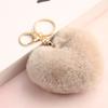 Llavero de bola de pelo de amor arcoíris corazón de durazno felpa accesorios para coche leopardo pareja colgante de corazón fabricantes mayoreo