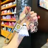 Boneca de cachorro de desenho animado bolsa de boneca pingente de bolsa bolsa mochila de casal pingente de badminton chaveiro atacado