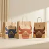 Bolsa de papel kraft al por mayor bolso personalizado bolsa para llevar café bolsa de regalo para manos tienda de ropa patrón impreso