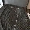 Nuevo conjunto de pijama de dos piezas para mujer estilo coreano de primavera y otoño, rayas blancas y negras vintage, cárdigan con cuello, manga larga, pantalón largo, conjunto casual para casa