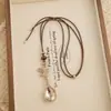 Nueva colección otoño/invierno: Collar colgante lágrima de piedra ojo de tigre color café, un accesorio de cadena larga delicado y lujoso para suéteres