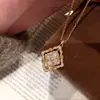 Estilo Vintage Italiano de Corte Blati Blanco Fritillaria Trébol de Cuatro Hojas Giratorio Colgante Ojo de Tigre de Alta Calidad para Mujer