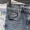 Shorts de mezclilla retro estilo americano, lavado de verano y acabado desgastado, corte recto holgado, nuevos shorts casuales de moda para hombre