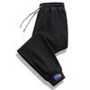 2024 Nuevos Pantalones Casuales Holgados para Hombre Estilo Hong Kong Modernos Versátiles Pantalones Delgados de Primavera y Otoño Pantalones Deportivos Venta al por Mayor por Lote