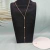 Fabricantes de joyas transfronterizas europeas y americanas para damas suministran directamente un collar con borlas de cristal en forma de Y con forma de gota de agua y cadena trasera.