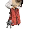 Bolso cubo con cordón de tela de nailon estilo coreano nuevo para mujer, mochila de viaje versátil, mochila escolar de gran capacidad para estudiantes, moda