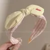 Diadema retorcida fresca y elegante, de lujo ligero para mujer, adecuada para el uso diario en primavera y verano, diadema de ala ancha, dulce accesorio para el cabello estilo coreano