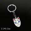 Llavero colgante de aleación de metal con diseño de mariposa Zhilang You Bean de Anime Ghost Extermination Blade que rodea el carbón. Comercio exterior.