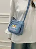 Bolso de mezclilla lavado bordado con gato lindo, nuevo, transfronterizo 2026, para mujer, versátil, con múltiples bolsillos, de hombro y cruzado