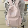 Mochila de nailon de color liso de alta moda 2026, bolsa de secundaria moderna y ligera con gran capacidad
