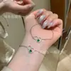 Suministro directo al por mayor de fábrica de material peligroso natural pulsera de jade de calabaza verde Yang incrustaciones de plata s925 diseño pequeño y fresco