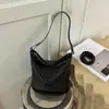 Bolsa Feminina de Axila 2026 Nova Moda Popular de Verão High-End Nicho para Deslocamento Ombro Único Transversal Bolsa Saco