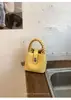 Bolso cubo texturizado de comercio exterior transfronterizo para mujer, 26 modelos nuevos, bolso de mano de alta estética casual, bolso versátil de hombro y cruzado