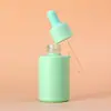 En stock 30ml color macarrón gotero subempaque botella de vidrio cilíndrica de hombro plano 20ml inyección cabeza de silicona botella redonda recta