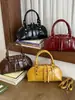 Bolsa feminina Shuai Mi Jia de cor sólida simples, nova bolsa feminina da moda, bolsa de ombro e transversal estilosa e única de nicho