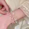 Pulsera de cuentas de trébol de cristal blanco y cristal rosa, sensación de lujo ligero y alta gama, dulce y simple, pulsera de nicho y versátil