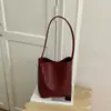 Tendencia de moda transfronteriza 2026, bolso pequeño para debajo del brazo para mujer, bolso de mano de alta gama para ir al trabajo, bolso de hombro, bolso tipo cubo