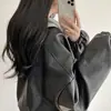 Chaqueta de cuero casual versátil de estilo americano, moderna, retro, para el trabajo, con bolsillo con cremallera, holgada, para mujer, nueva para primavera y otoño