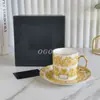 Juego de Taza y Platillo de Porcelana Fina Flor Amarilla Pequeña Fondo Blanco Estilo Europeo Taza y Platillo de Café Juego de Té para la Tarde Taza y Platillo Lujo Accesible Retro Regalo
