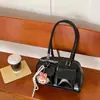 Bolsa Baguete de Ombro Tendência Estilo Coreano Moda de Nicho para Mulheres Novo Modelo Primavera 2026 Bolsa Boston de Ombro Único Bolsa de Bowling