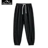 Novos Calças Casuais Esportivas de Fitness Elásticas Simples com Múltiplos Bolsos Estilo Coreano para Homens, Outono e Primavera, Tendência para Casais