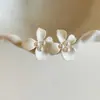 Pendientes de Perla Flor Blanca Aguja de Plata, de Moda y Versátiles, Pendientes de Lujo de Alta Gama, Accesorios para Orejas Súper Elegantes y Hermosos 2026