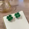 Aretes de Flor de Trébol de Cuatro Hojas Fresca Estilo Mori de Alta Calidad Dulces de Doble Cara Piedra Ojo de Gato Pendientes Versátiles