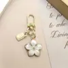 Nuevo Artículo Popular de Venta Cruzada Flor de Cinco Hojas Coreana Colgante de Pera Llavero Colgante de Bolsa Flor de Cerezo Pequeño Regalo