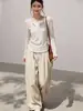Conjunto de dos piezas de estilo coreano, relajado, a rayas, de manga larga para mujer, para primavera y otoño, con textura cepillada y colores contrastantes, presentando un elegante diseño de camiseta de hombros rectos