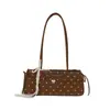 Bolso de axila de moda estilo coreano transfronterizo para mujer, nuevo bolso baguette de lunares con lazo, bolso de hombro y bolso de mano moderno y elegante