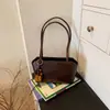 Bolsa tote casual, simples e versátil para mulheres, nova moda 2026, toque de luxo, bolsa de ombro de grande capacidade, bolsa de mão para o dia a dia