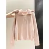 Suéter de punto tipo polo coreano para mujer, con diseño de tres botones, tela suave y cómoda, corte corto y holgado, y estilo dulce de manga larga, perfecto para otoño e invierno.