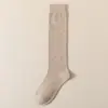 Calcetines altos para pantorrilla personalizados otoño e invierno JK japonés cálidos calcetines largos para pierna adelgazantes para pierna calcetines para mujer absorbentes de sudor micro-presión calcetines para pierna bonita mujer