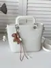Bolso de cubo de moda con patrón tejido para mujer, nuevo estilo coreano 2026, bolso de mano versátil para salidas diarias y para ir al trabajo, bolso cruzado