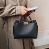 Bolso de hombro cruzado de moda europeo y americano simple con cierre, textura ins, personalidad, cubo casual para mujer, bolso con cierre giratorio