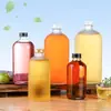 En stock Botella de vino de frutas Boston de 100 ml Botella para bebidas esmerilada de 250 ml Botella para vino de frutas casero de 500 ml Pegatina con logo