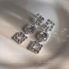 ¡Señorita Qian Jin! Pendientes largos de lujo ligero con diamantes completos, diseño de nicho, pendientes franceses, pendientes de alta calidad para adelgazar el rostro
