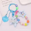 Nuevo Collar de Perlas Perro Burbuja Muñeco Llavero Colgante, Estilo Fresco Estrella de Cinco Puntas Adorno de Bolsa con Cuentas de Colores