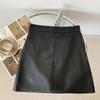 Falda corta de cuero sintético para mujer, otoño e invierno 2023, antideslumbrante, de cintura alta, ajustada, de corte A