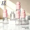 Productos en Stock: Tapa de Bola Rosa para Tubo Redondo, Tubo de Brillo de Labios con Cepillo Fino, Material de Empaque de Tubo Vacío de Plástico