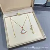 2026 Nuevo Modelo Collar con Forma de Abanico de Oro de 18 Quilates, Diamante y Lapislázuli Cadena para Clavícula Mini Falda Turquesa Diva para Mujer