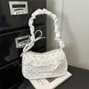 Bolso de lunares de nicho súper popular para mujer, nuevo bolso de moda 2026 versátil para hombro y axila, bolso de mano pequeño exquisito