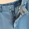 Foto real de shorts de mezclilla vintage azules talla extra para mujer, verano 2026, shorts holgados de pierna ancha de longitud media de cintura alta con retazos