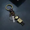 Chaveiro Simples de Couro Vintage Tecido à Mão com Pingente de Robô de Liga, Acessório Personalizado para Bolsa